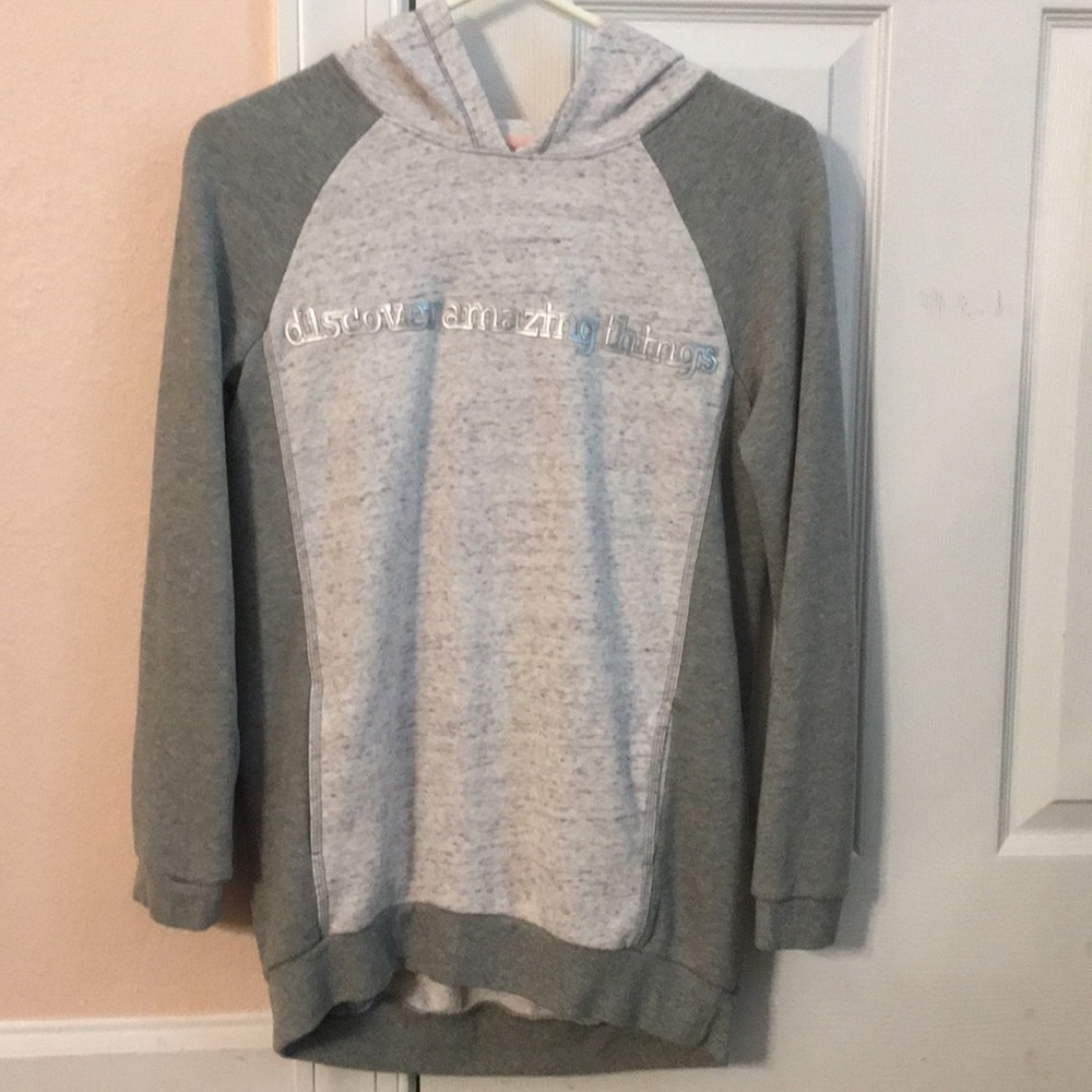 a grey sweatshirt.